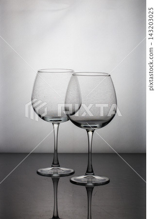Still life with glassware on a gray background Still life with glassware on a gray background 143203025