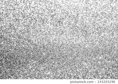 Silver glitter background with sparkling bokeh texture for festive and glamour design Silver glitter background with sparkling bokeh texture for festive and glamour design 143203296
