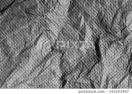 Abstract dark grey crumpled fabric texture background with rough wrinkles Abstract dark grey crumpled fabric texture background with rough wrinkles 143203407