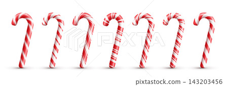 Classic red and white striped candy canes on a white background. Classic red and white striped candy canes on a white background. 143203456