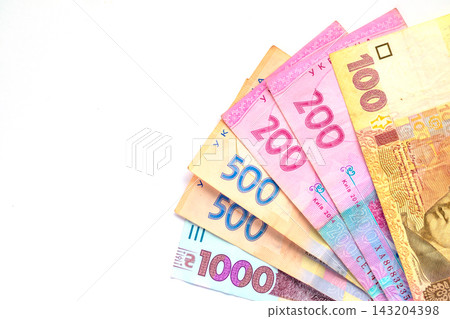 Ukrainian hryvnia banknotes fanned on white background representing money and finance Ukrainian hryvnia banknotes fanned on white background representing money and finance 143204398