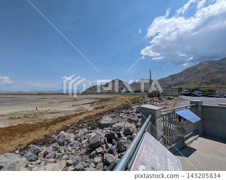 Expansive view of the Great Salt Lake shoreline under a bright blue sky. Expansive view of the Great Salt Lake shoreline under a bright blue sky. 143205834