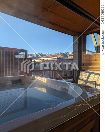 Cozy Hot Tub with Scenic Mountain Views in Park City, Utah at Dusk. 143206032