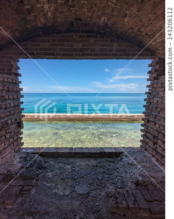 Scenic Ocean View through Historic Brick Archway at Dry Tortugas National Park. Scenic Ocean View through Historic Brick Archway at Dry Tortugas National Park. 143206112