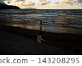 A woman playing in the sea at Zenibako Beach 143208295