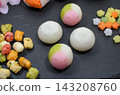 Dumplings, rice crackers, and konpeito candy for the Hina Matsuri festival. 143208760