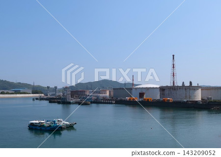 A landscape of coastal industrial zones and oil storage tanks. A landscape of coastal industrial zones and oil storage tanks. 143209052