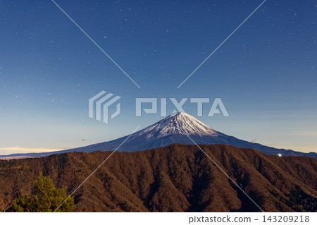 Mount Fuji under the moonlight, as seen from Shakagatake in the Misaka Mountains. Mount Fuji under the moonlight, as seen from Shakagatake in the Misaka Mountains. 143209218