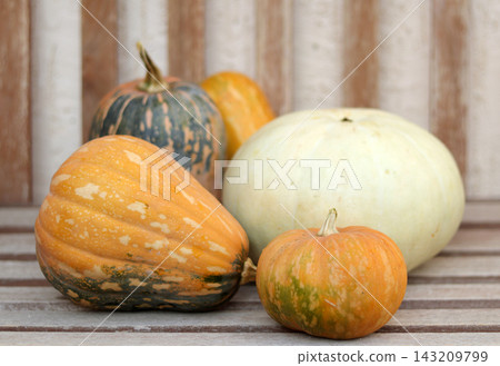 pumpkins on wooden background pumpkins on wooden background 143209799
