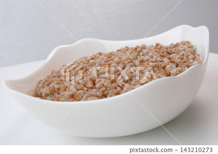groats in plate on white groats in plate on white 143210273