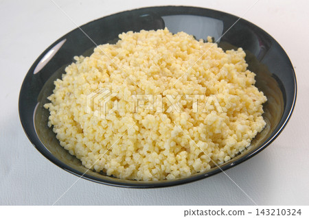 groats in plate on white groats in plate on white 143210324