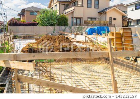 A detached house construction site - reinforced concrete slab foundation. A detached house construction site - reinforced concrete slab foundation. 143212157