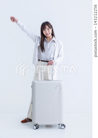 A woman with a suitcase A woman with a suitcase 143212256