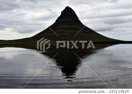 Water ripples breaking the reflection of Kirkjufell mountain, Iceland Water ripples breaking the reflection of Kirkjufell mountain, Iceland 143213624