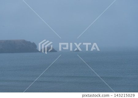 The rocky reefs near Nemuro and the Pacific Ocean, shrouded in fog. The rocky reefs near Nemuro and the Pacific Ocean, shrouded in fog. 143215029