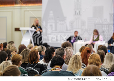 Conference audience facing speakers during a panel discussion Conference audience facing speakers during a panel discussion 143215599