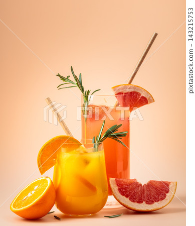 Orange and grapefruit juice with rosemary and ice. Orange and grapefruit juice with rosemary and ice. 143215753