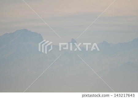 Mountains on the opposite shore of Lake Geneva shrouded in mist, as seen from Lausanne, Switzerland (January 3, 2020) Mountains on the opposite shore of Lake Geneva shrouded in mist, as seen from Lausanne, Switzerland (January 3, 2020) 143217643