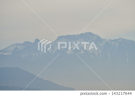 Mountains on the opposite shore of Lake Geneva shrouded in mist, as seen from Lausanne, Switzerland (January 3, 2020) Mountains on the opposite shore of Lake Geneva shrouded in mist, as seen from Lausanne, Switzerland (January 3, 2020) 143217644