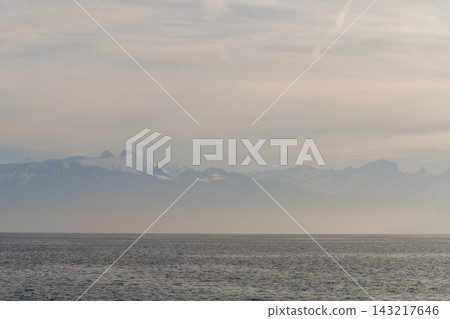 Mountains on the opposite shore of Lake Geneva shrouded in mist, as seen from Lausanne, Switzerland (January 3, 2020) Mountains on the opposite shore of Lake Geneva shrouded in mist, as seen from Lausanne, Switzerland (January 3, 2020) 143217646