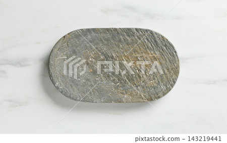 new empty grey stone tray on white marble kitchen table top background new empty grey stone tray on white marble kitchen table top background 143219441