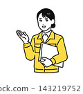 A young woman in work clothes holding a file and giving an explanation. 143219752