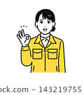 A young woman in work clothes makes an OK sign. 143219755