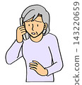 An elderly woman is confused on the phone. 143220659