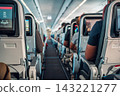 Passengers Seated Inside Airplane Cabin 143221277
