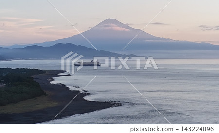 A cruise ship sailing across Suruga Bay at sunrise, passing in front of Mt. Fuji, and Miho no Matsubara (Izu Peninsula) - drone aerial footage. A cruise ship sailing across Suruga Bay at sunrise, passing in front of Mt. Fuji, and Miho no Matsubara (Izu Peninsula) - drone aerial footage. 143224096