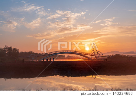 Sunrise Dawn over Misaeng Bridge with Water Reflection in Siheung Wetland, South Korea Sunrise Dawn over Misaeng Bridge with Water Reflection in Siheung Wetland, South Korea 143224693