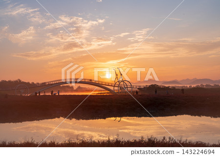 Sunrise Dawn over Misaeng Bridge with Water Reflection in Siheung Wetland, South Korea Sunrise Dawn over Misaeng Bridge with Water Reflection in Siheung Wetland, South Korea 143224694