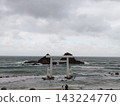 A large torii gate and Meotoiwa (Married Couple Rocks) floating in the sea (Sakurai Futamigaura) 143224770