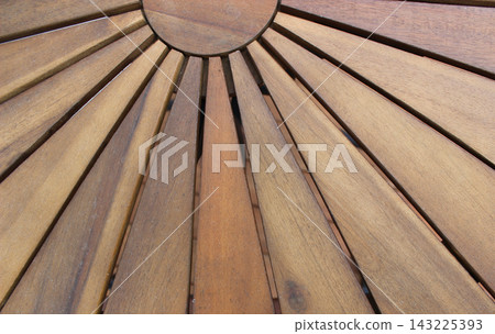 Wooden plank pattern that resembles the rays of the rising sun. Wooden furniture and decoration design Wooden plank pattern that resembles the rays of the rising sun. Wooden furniture and decoration design 143225393