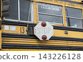 American-style yellow school bus side and emergency exit window 143226128