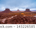 Sandstone buttes rising through fog, Monument Valley Tribal Park, Arizona, USA 143226585