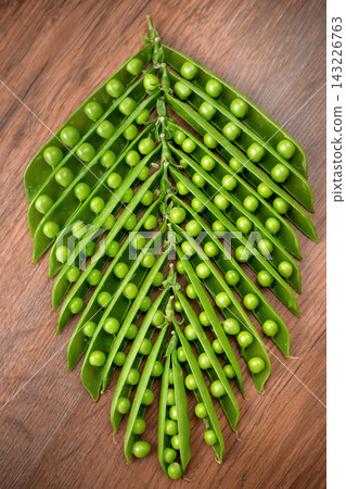 green peas, open pea sticks green peas, open pea sticks 143226763