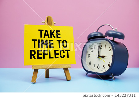 Take Time To Reflect text with alarm clock on pink and blue background 143227311