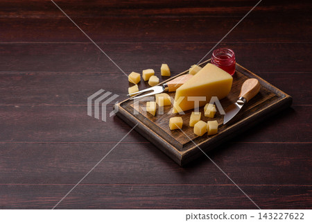 Hard aged Parmesan cheese in blocks and cubes for home cooking. Parmesan cheese Hard aged Parmesan cheese in blocks and cubes for home cooking. Parmesan cheese 143227622