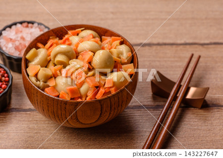 Small whole canned button mushrooms in oil with carrot pieces, salt, and spices. Canned mushrooms Small whole canned button mushrooms in oil with carrot pieces, salt, and spices. Canned mushrooms 143227647