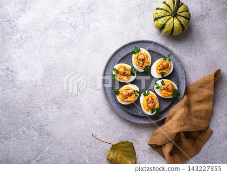 Deviled Eggs decorated with skull Deviled Eggs decorated with skull 143227855