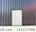 Warehouse exterior, entrance door to the storage area 143227988