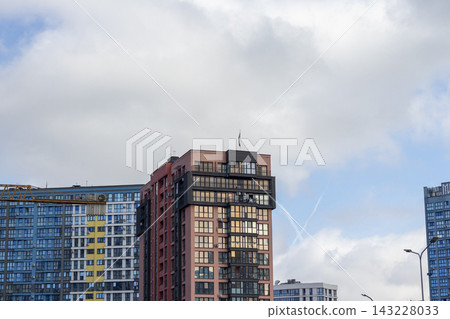 Modern residential apartment building with numbered glass window facade. City Modern residential apartment building with numbered glass window facade. City 143228033