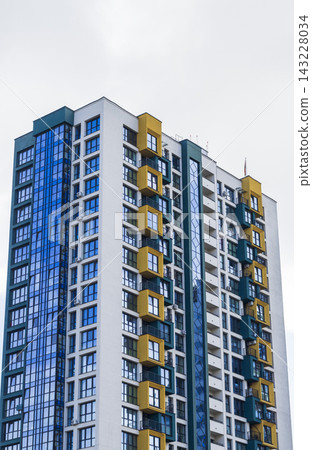 Modern residential apartment building with numbered glass window facade. City Modern residential apartment building with numbered glass window facade. City 143228034