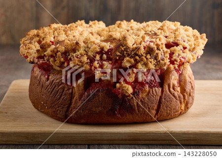 Homemade Berry Crumble Cake on a Wooden Board Homemade Berry Crumble Cake on a Wooden Board 143228050