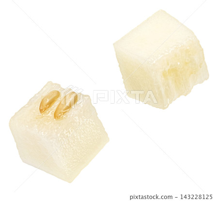 Falling sweet melon cubes isolated on white background Falling sweet melon cubes isolated on white background 143228125