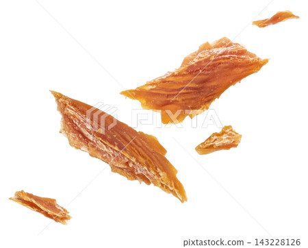 Falling dried fish pieces isolated on white background full depth of field 143228126