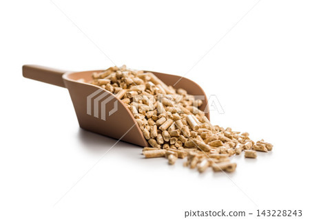 Wood Pellet Fuel Pile With Red Scoop Close-Up Biomass Heating Pellets For Stove And Boiler 143228243
