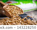 Wood Pellets And Calculator On Table Representing Biofuel Heating Costs And Renewable Energy Budgeting 143228250