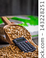Wood Pellets And Calculator On Table Representing Biofuel Heating Costs And Renewable Energy Budgeting 143228251